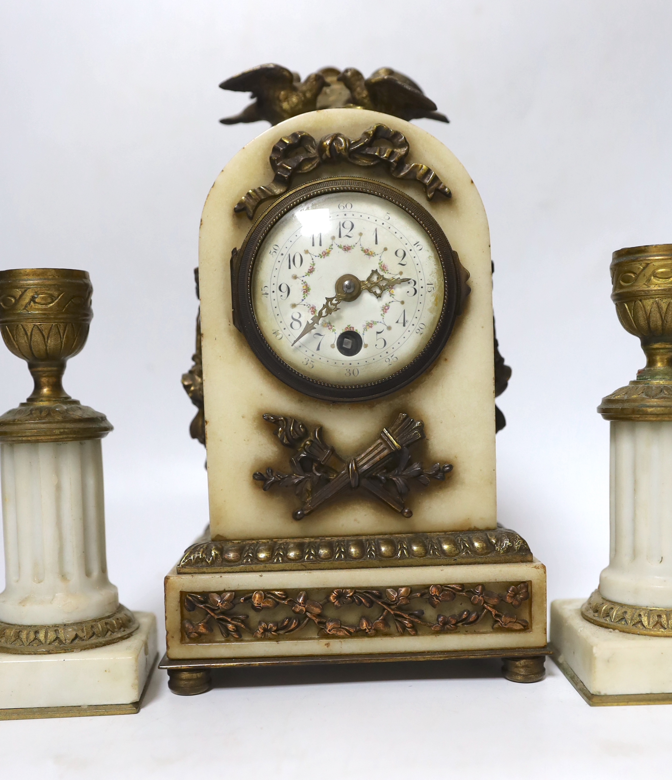 A French marble and ormolu clock garniture, early 20th century, clock 21cm high